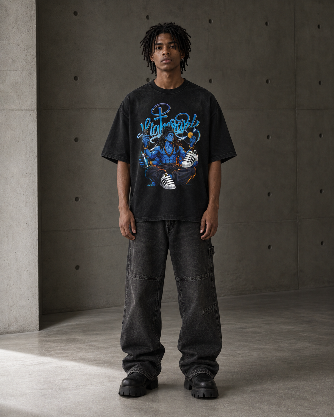 Model wearing the Higher Ark 4 Elements vintage washed graphic tee in a concrete studio