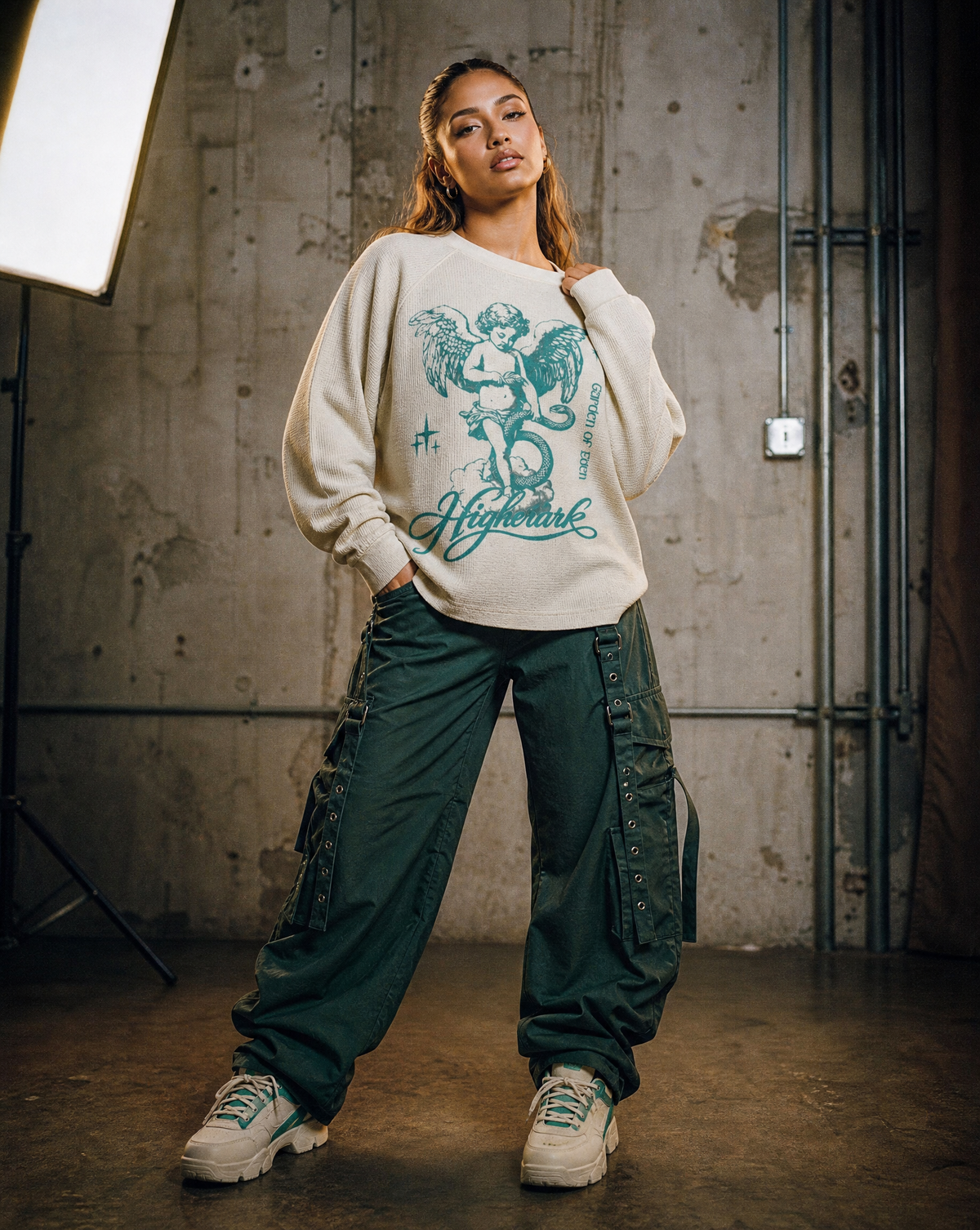Model wearing the Higher Ark Garden of Eden waffle top in an industrial studio