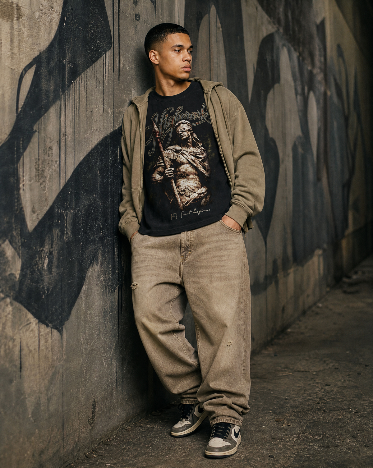 Model wearing the Higher Ark Saint Longinus vintage washed graphic tee in an urban streetwear photo