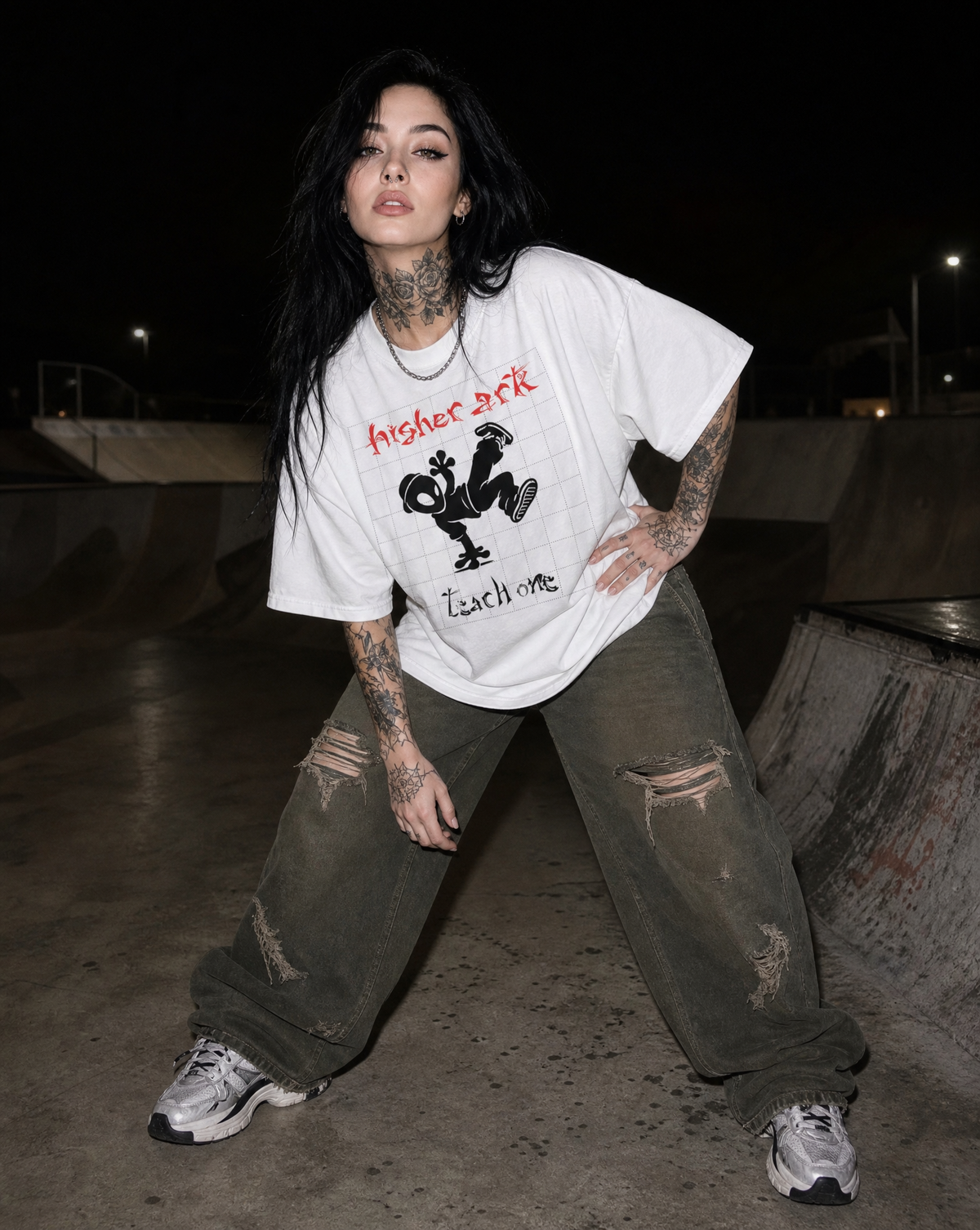 Model wearing the Higher Ark Each One Teach One graphic tee at a skatepark at night