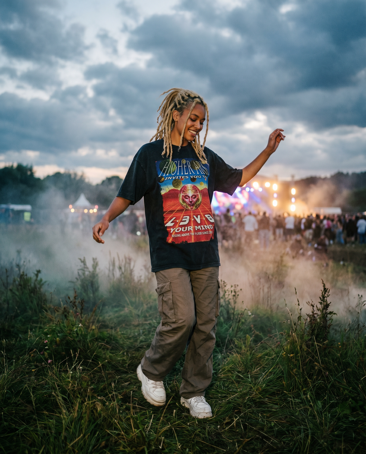 Model dancing in the Higher Ark Fantazia vintage washed graphic tee at an outdoor rave festival