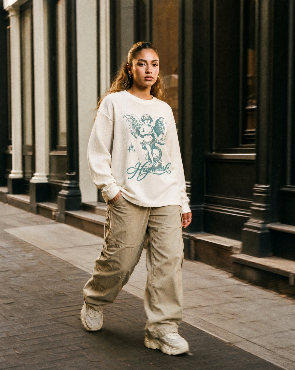 Model wearing the Higher Ark Garden of Eden waffle top in a streetwear lifestyle photo