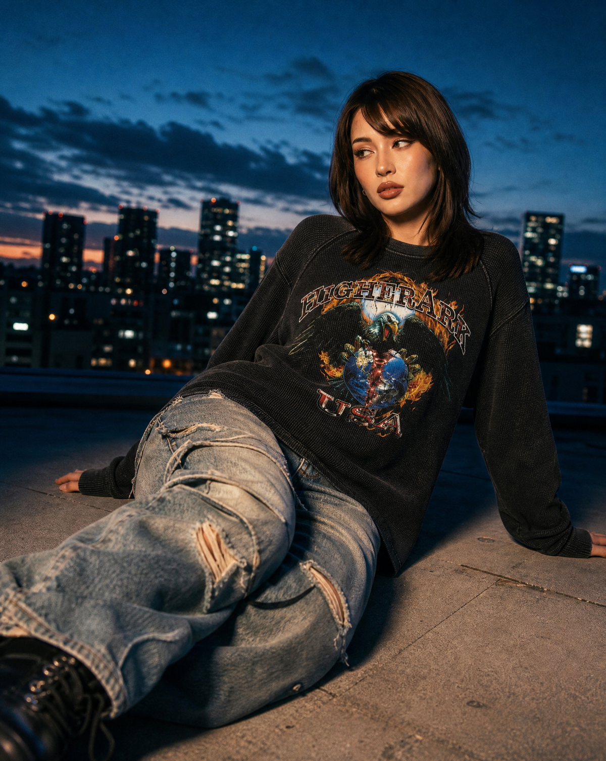 Model wearing the Higher Ark Land of the Free waffle top in a rooftop lifestyle photo